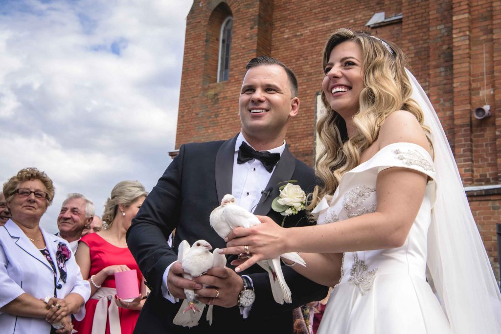 Joyful couple laughing together during their wedding vows.