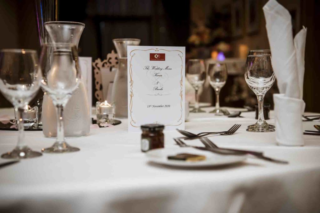Guests signing a creative guestbook with well-wishes and drawings.