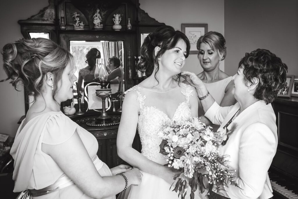 Bride and bridesmaids in a stunning pose, radiating elegance.