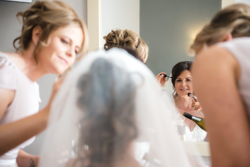 Bride surrounded by her bridesmaids, showcasing their beauty.