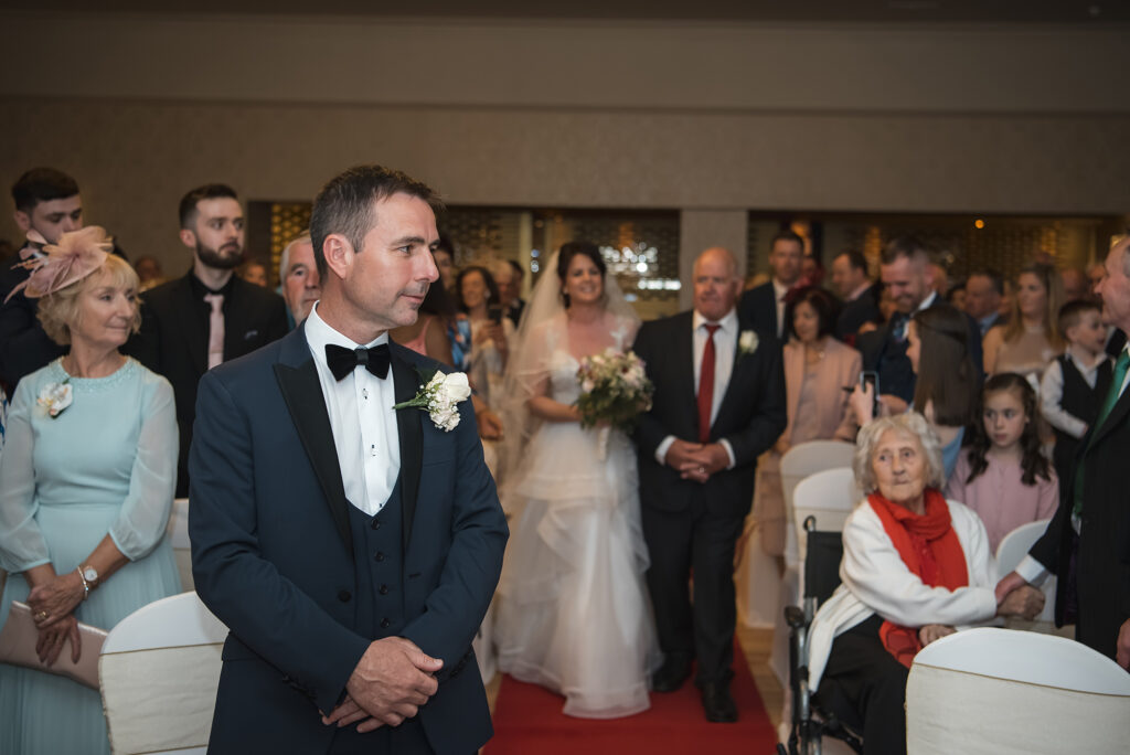 Father-daughter dance with tears of joy at a garden wedding.