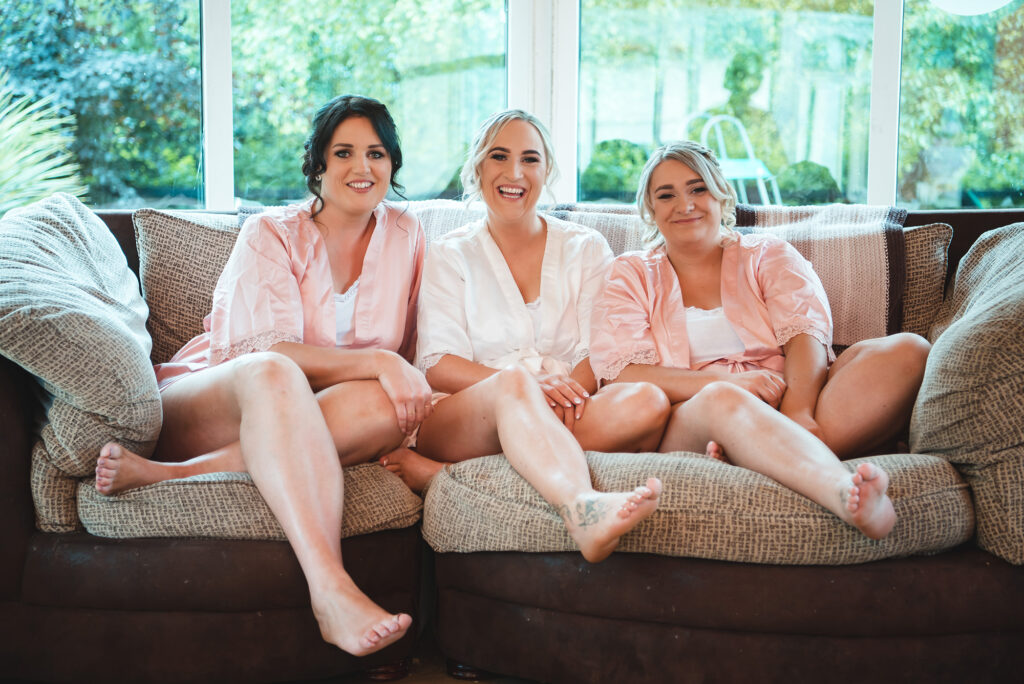 Chic bridal party with the bride and bridesmaids striking a pose.