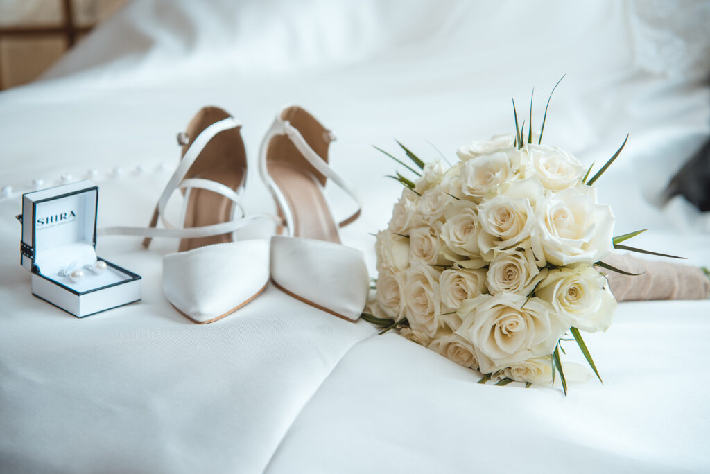 Bride's bouquet of vibrant sunflowers against a blue sky backdrop.