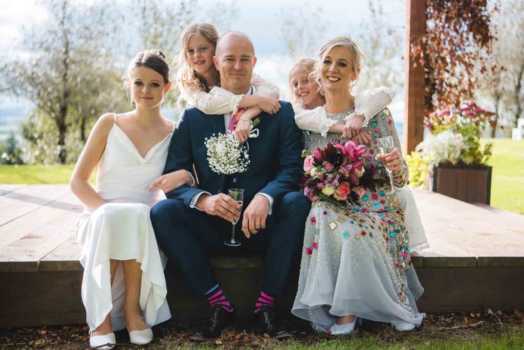 Vintage-inspired wedding table settings with candles and lace.